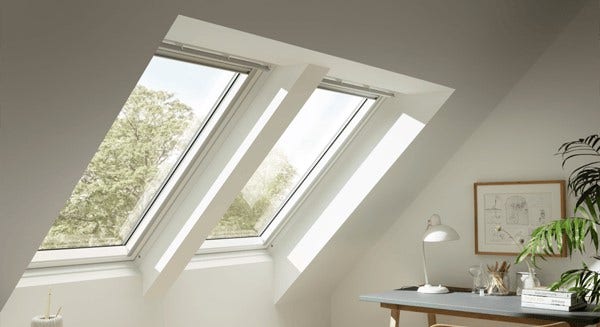 two velux white painted roof windows in loft